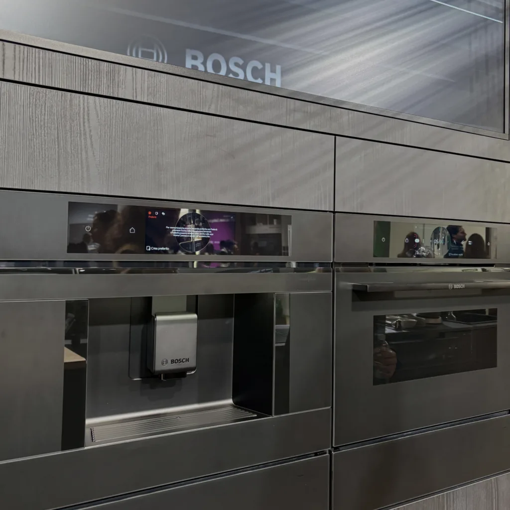 Bosch kitchen appliances in brushed black stainless steel within a monochromatic matte black kitchen design