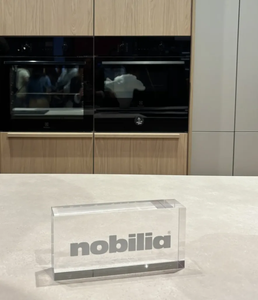 Nobilia kitchen cabinetry featuring textured surfaces and contrasting beige cabinet accents